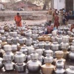 EMPTY POTS QUEUED UP IN LONG WAIT