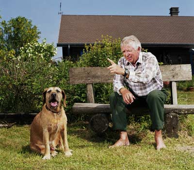 Senior man talking to a dog