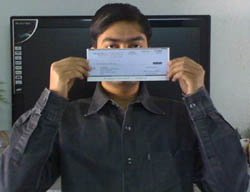 Uttoran Sen with his online earning's check