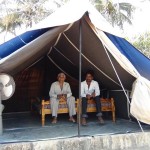 Kalubhai & his associate Jagabhai sitting inside tent.