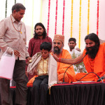 Uttam Maru with Baba Ramdevji.